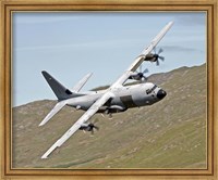 Framed C-130J Super Hercules low flying over North Wales on a training flight