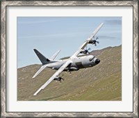 Framed C-130J Super Hercules low flying over North Wales on a training flight