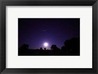 Framed bolide from the Geminids meteor shower above a setting moon in Mercedes, Argentina