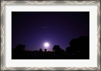 Framed bolide from the Geminids meteor shower above a setting moon in Mercedes, Argentina