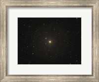 Framed red giant star Beta Andromedae and its ghost galaxy NGC 404