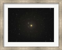 Framed red giant star Beta Andromedae and its ghost galaxy NGC 404