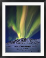 Framed Aurora Borealis over Toviktinden Mountain in Troms County, Norway