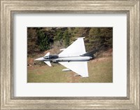 Framed Eurofighter Typhoon F2 aircraft of the Royal Air Force low flying over North Wales