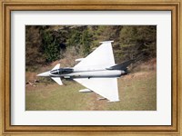 Framed Eurofighter Typhoon F2 aircraft of the Royal Air Force low flying over North Wales