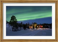 Framed Aurora Borealis over farm houses, Tennevik Lake, Troms, Norway