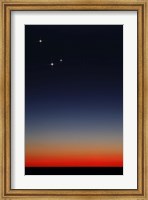 Framed Venus, Mercury and Mars above the glowing horizon at dawn