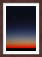 Framed Venus, Mercury and Mars above the glowing horizon at dawn