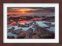 Framed Tidal pools reflect the sunrise colors during the autumn equinox