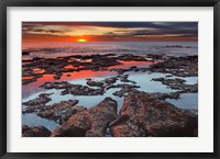 Framed Tidal pools reflect the sunrise colors during the autumn equinox