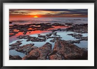 Framed Tidal pools reflect the sunrise colors during the autumn equinox