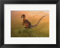 Framed Sinosauropteryx dinosaur resting on a log