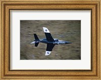 Framed Alpha Jet of the Royal Air Force low level flying over North Wales