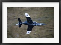 Framed Alpha Jet of the Royal Air Force low level flying over North Wales