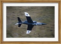 Framed Alpha Jet of the Royal Air Force low level flying over North Wales