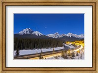 Framed moonlit nightscape over the Bow River and Morant's Curve in Banff National Park, Canada