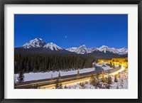 Framed moonlit nightscape over the Bow River and Morant's Curve in Banff National Park, Canada