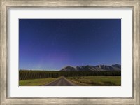 Framed Northern autumn constellations rising over a road in Banff National Park, Canada