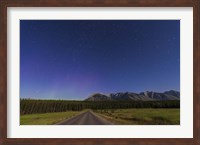 Framed Northern autumn constellations rising over a road in Banff National Park, Canada