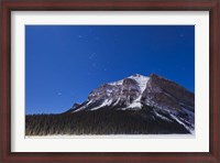Framed Orion star trails above Mount Fairview, Alberta, Canada