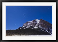 Framed Orion star trails above Mount Fairview, Alberta, Canada