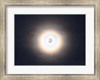 Framed bright halo around the full moon