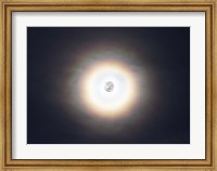 Framed bright halo around the full moon