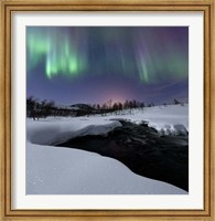Framed Aurora Borealis over Blafjellelva RIver in Troms County, Norway