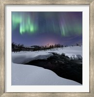 Framed Aurora Borealis over Blafjellelva RIver in Troms County, Norway
