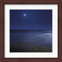 Framed Venus shines brightly below the crescent Moon from coast of Buenos Aires, Argentina