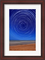Framed Star trails around the south celestial pole at the beach in Miramar, Argentina