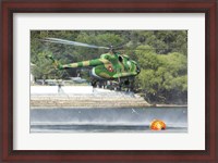 Framed Bulgarian Air Force Mi-17 taking water with Bambi Bucket