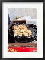 Framed China, Shanghai. Village of Zhujiajiao. Homemade snacks cooked in wok.