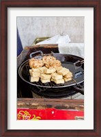 Framed China, Shanghai. Village of Zhujiajiao. Homemade snacks cooked in wok.