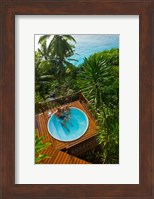 Framed Couple enjoying hot tub at Fregate Resort, Seychelles