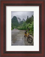 Framed Bicycle sits in front of the Guilin Mountains, Guilin, Yangshuo, China