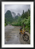 Framed Bicycle sits in front of the Guilin Mountains, Guilin, Yangshuo, China