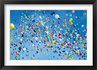 Framed Holiday balloons drifting into the sky