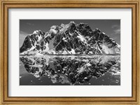 Framed Antarctica, Mountain peaks reflected in the Lemaire Channel.