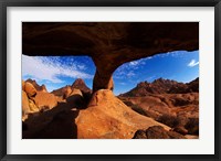 Framed Boy under natural rock arch at Spitzkoppe, Namibia