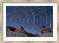 Framed boulder outcropping and star trails in Anza Borrego Desert State Park, California