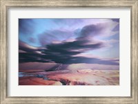 Framed swift moving thunderstorm moves over a desert landscape