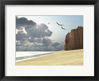 Framed Sunlight shines down on two birds flying near a cliff by the ocean