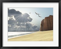 Framed Sunlight shines down on two birds flying near a cliff by the ocean