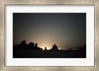 Framed Large tufa formations at Trona Pinnacles against a backdrop of stars
