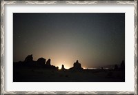 Framed Large tufa formations at Trona Pinnacles against a backdrop of stars