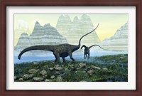 Framed Diplodocus dinosaurs munch on vegetation near a mountain lake