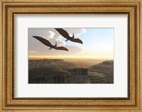 Framed Two Pterodactyl flying dinosaurs soar above a beautiful canyon