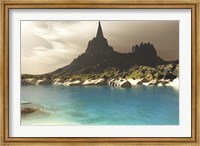 Framed mountain spire overlooking the turquoise waters of a sea inlet