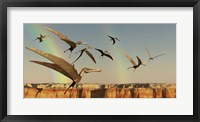 Framed flock of Pterodactyls fly out of a canyon